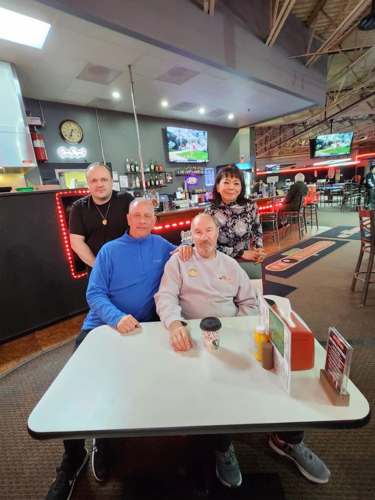 Image of Jimmy Wetch and His father, pictured in the center. On the left is Junior and on the Right is Suzie. They are both members of staff